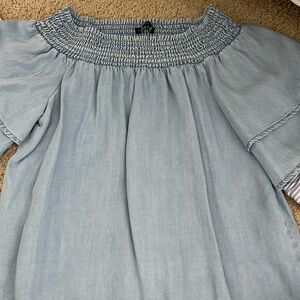 This blue denim off the shoulder top from Cotton on is in a size XS.